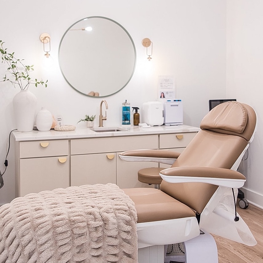 Modern beauty treatment room with comfortable chair.