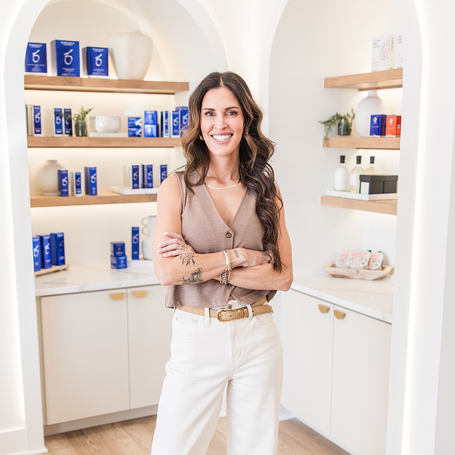 Smiling woman in a stylish skincare store.