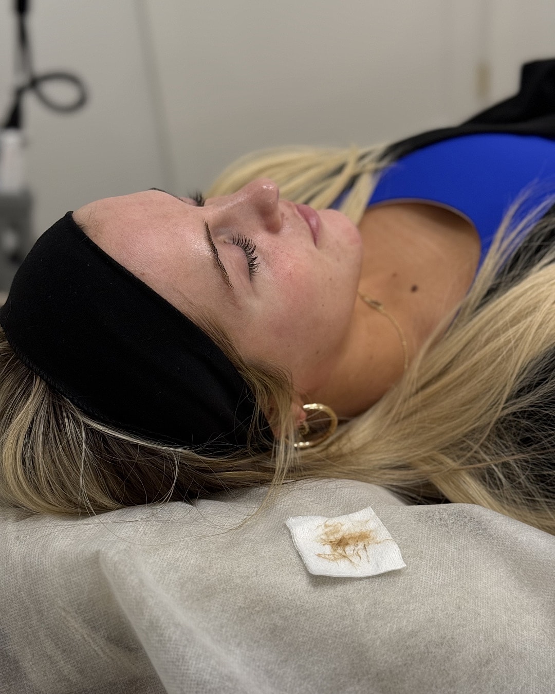 Woman resting during a beauty treatment session.