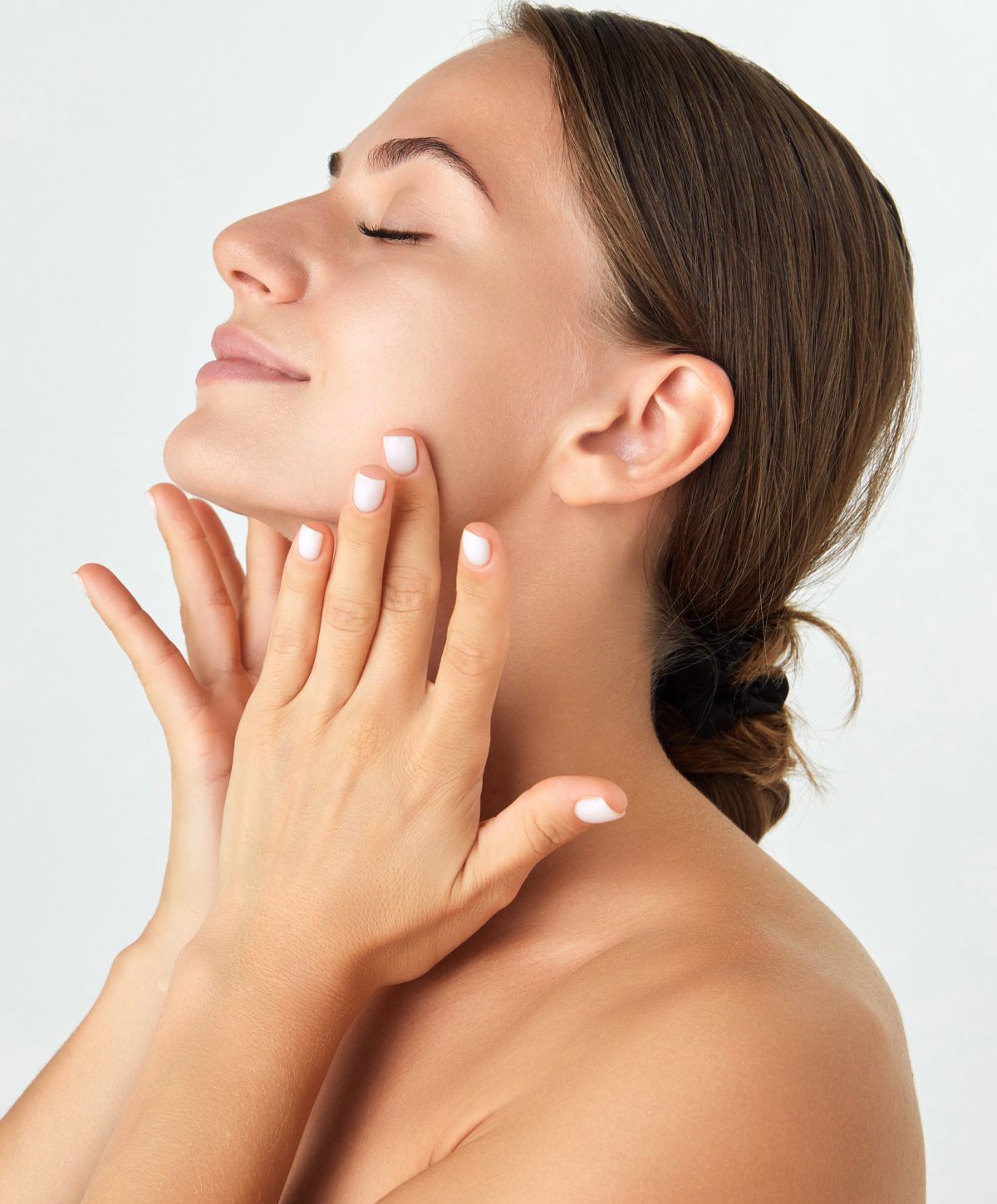 Woman enjoying a facial skincare treatment.