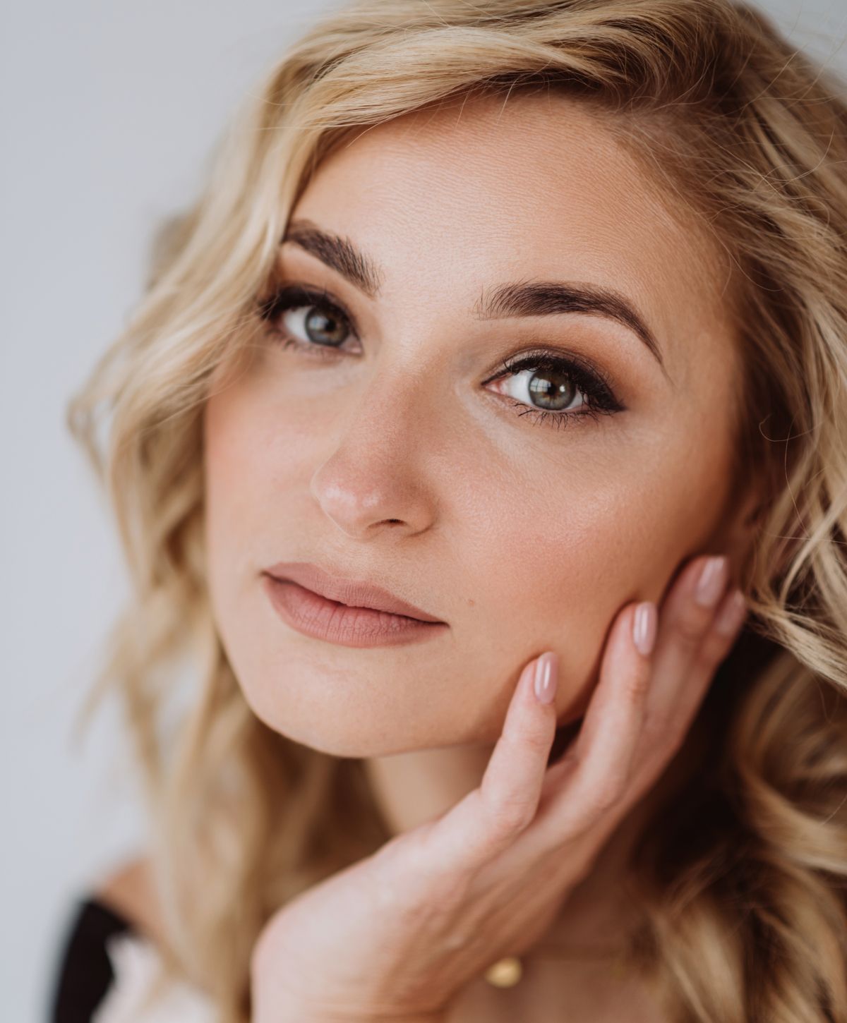 Close-up of a woman with wavy hair.
