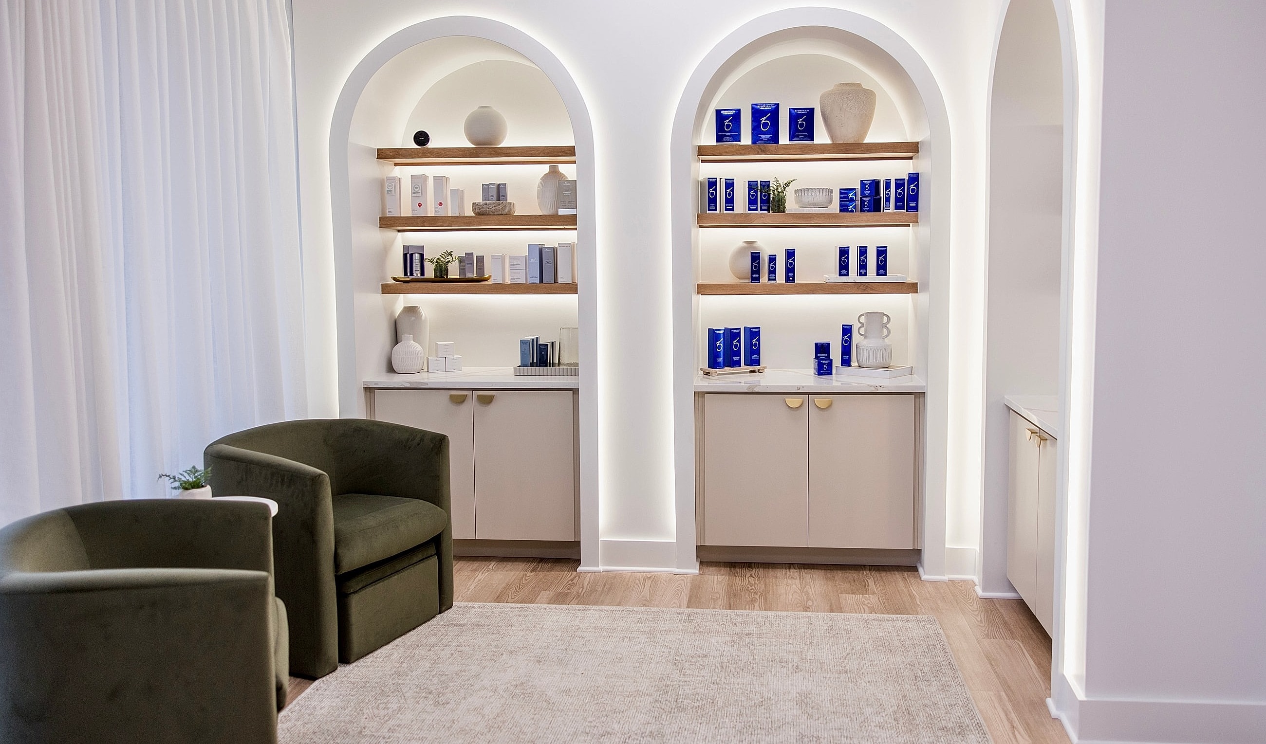 Stylish spa interior with shelves and seating.