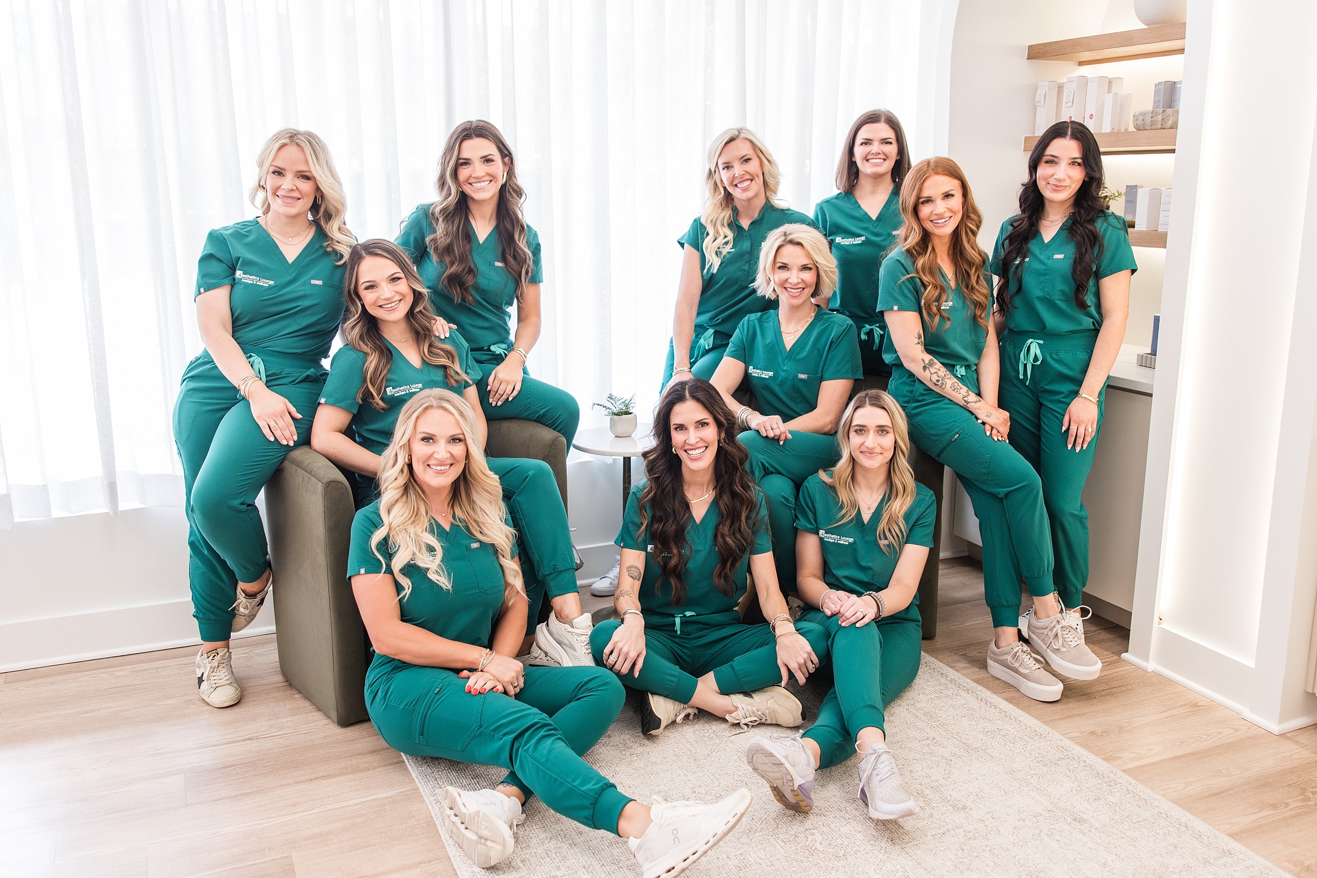 Team of healthcare professionals in green scrubs.