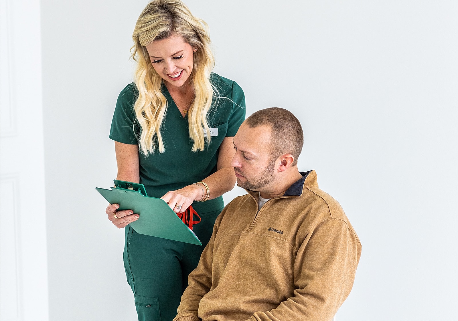 Healthcare professional consulting with a patient.