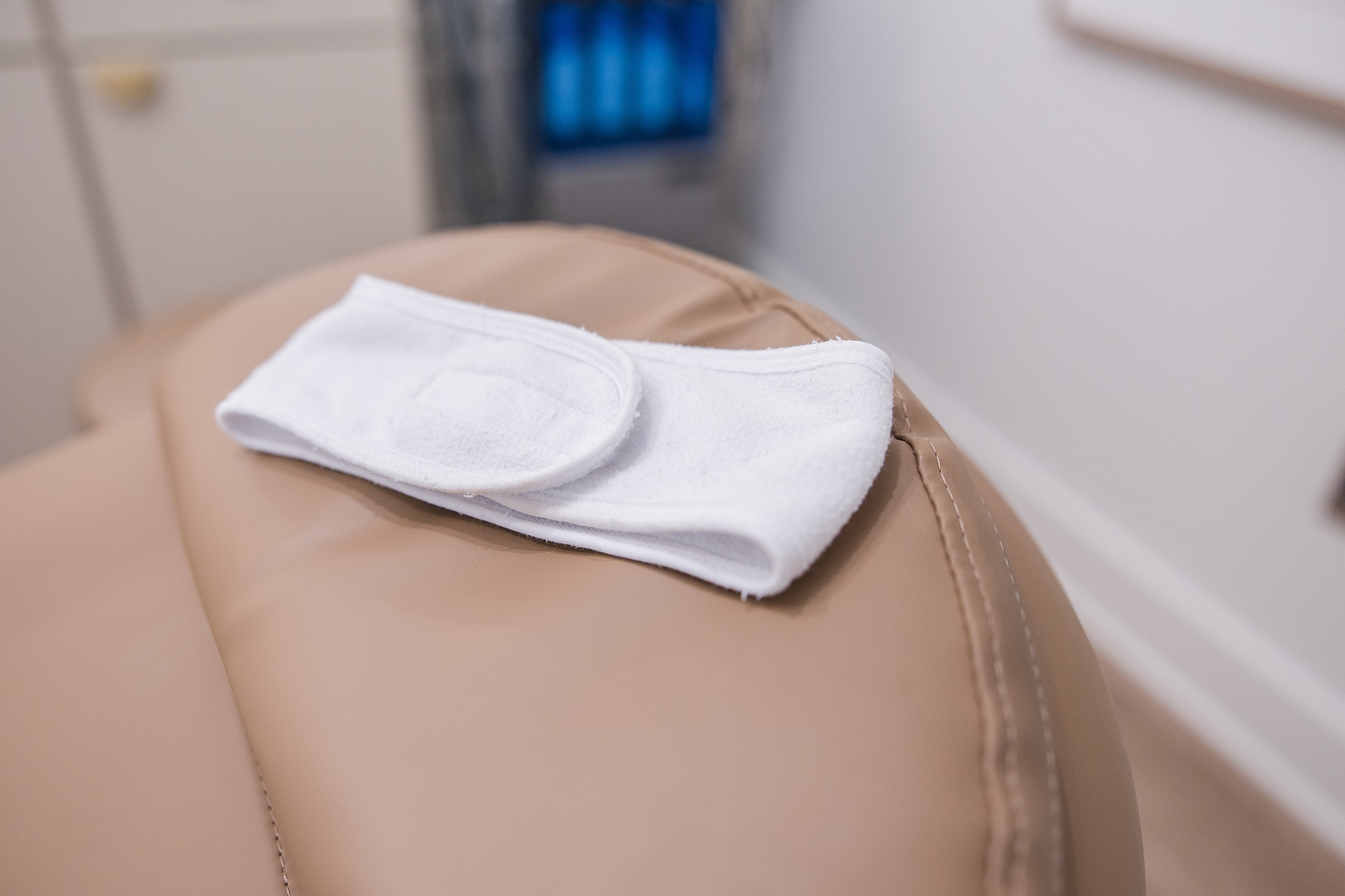 White towel on a leather massage chair.