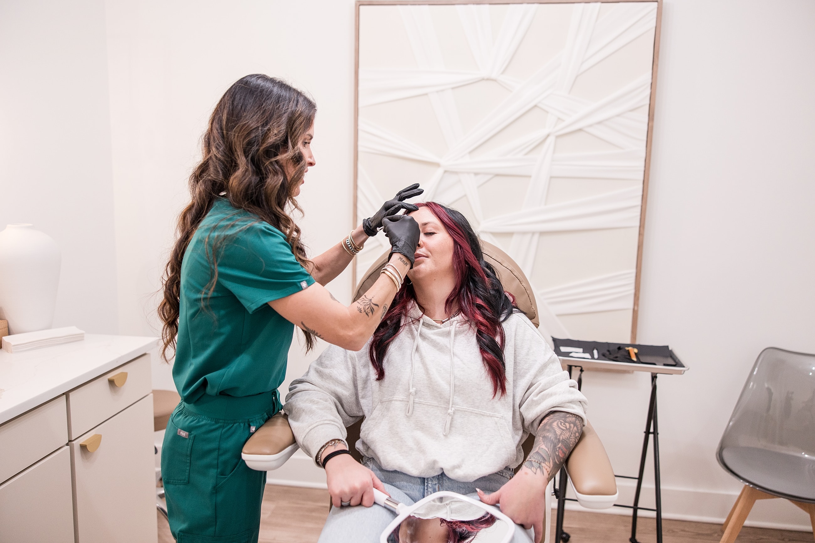 Client receiving a beauty treatment in studio.