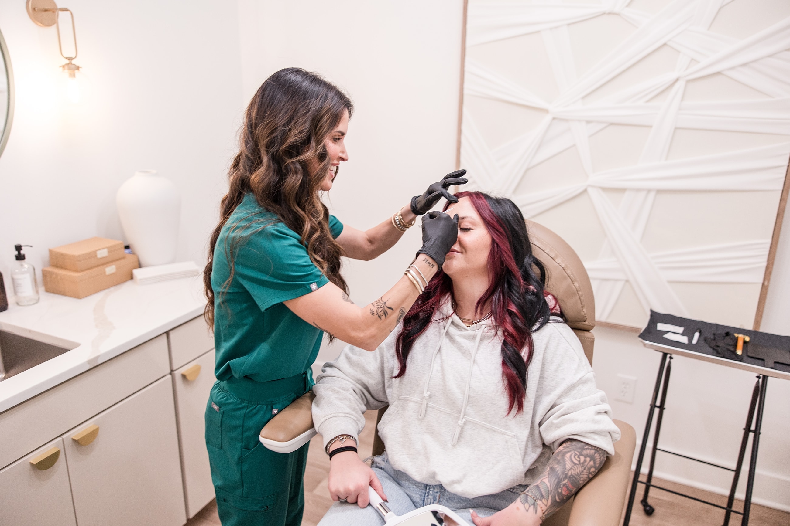 Beauty treatment session in modern salon setting.