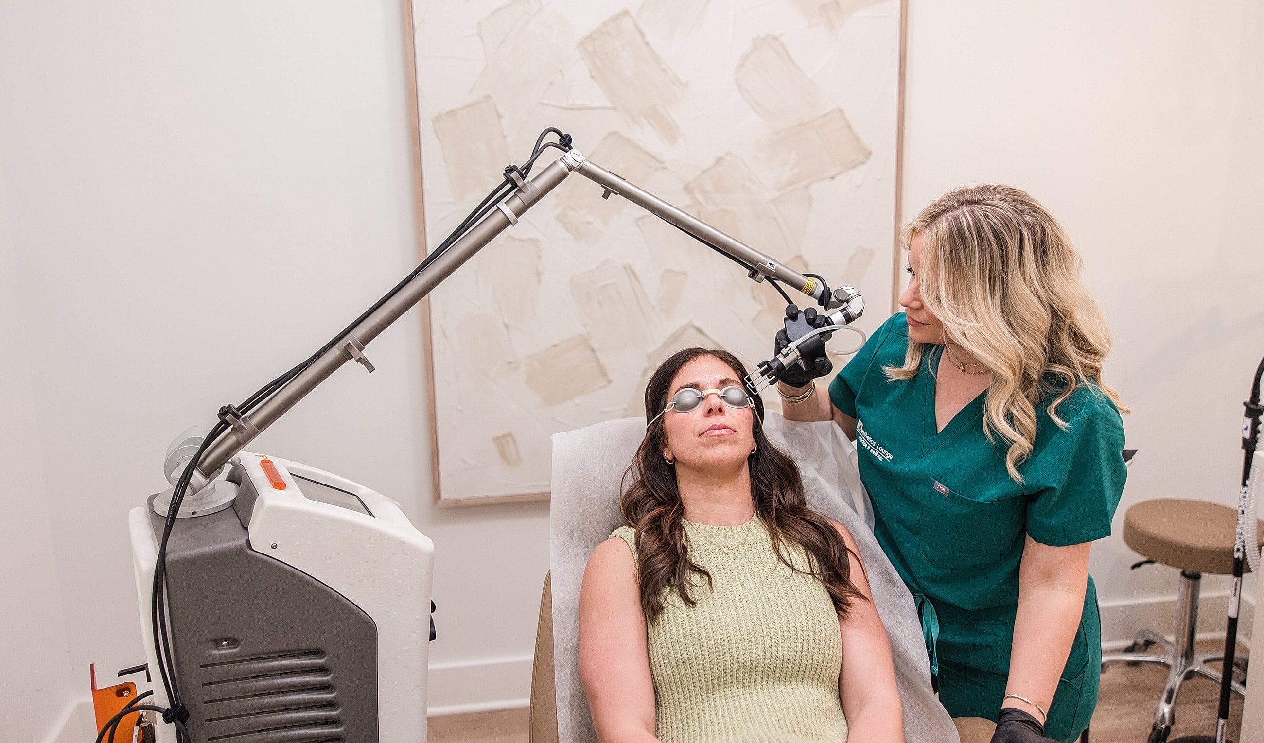 Woman receiving a skincare treatment in clinic.